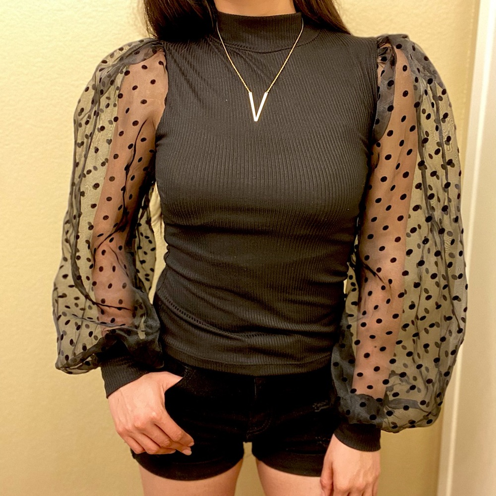 Elegant black blouse with puffy sleeves